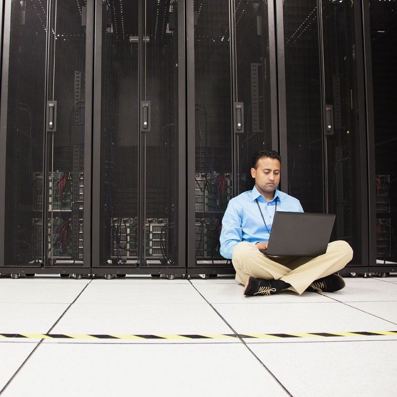 engineer-using-laptop-in-server-room.jpg