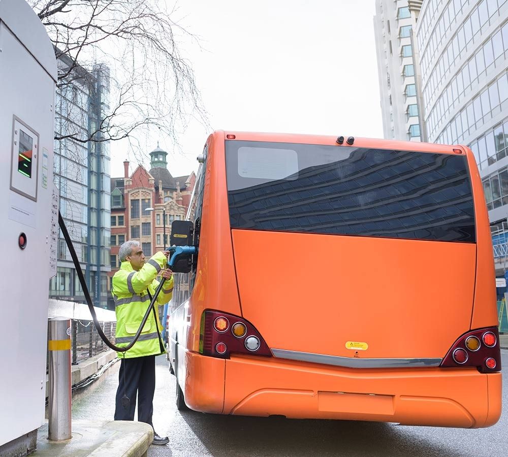 man-charging-electric-bus.jpg